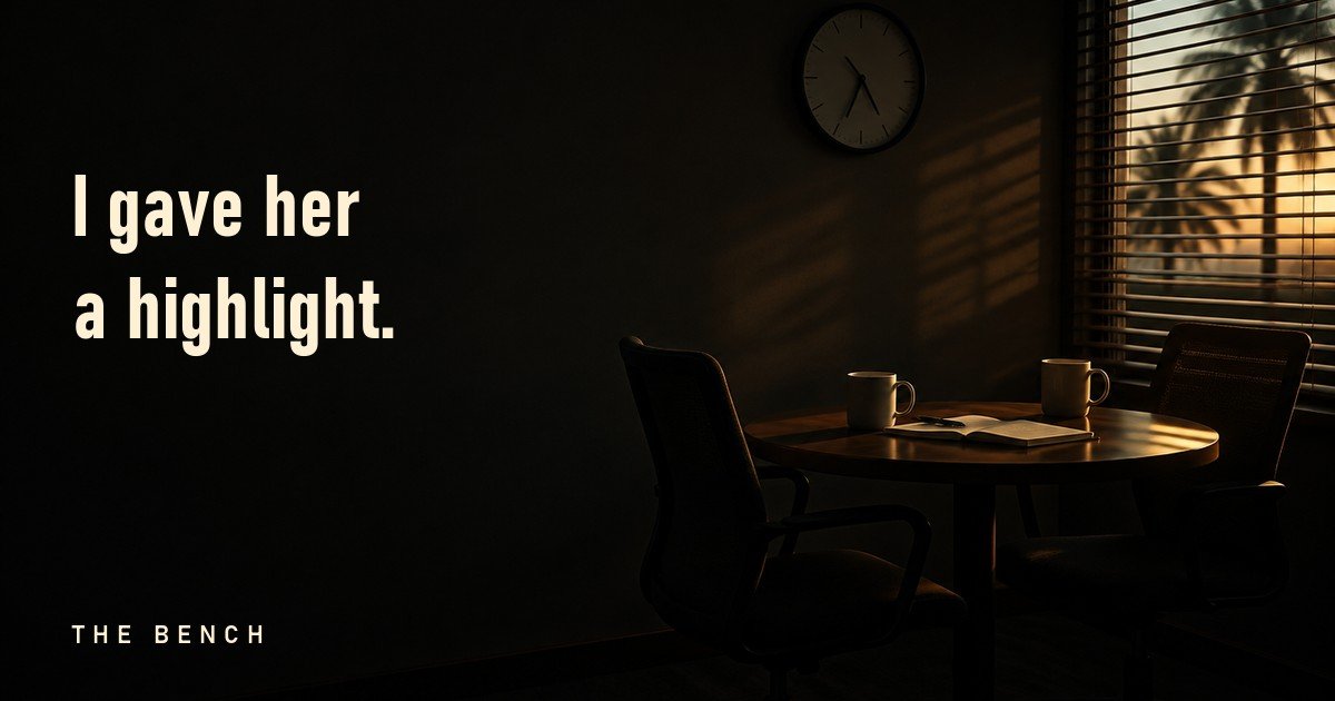 An empty office meeting room at dusk: two chairs pulled close at a small table, two mugs left behind, a clock on the wall. Text reads: I gave her a highlight.